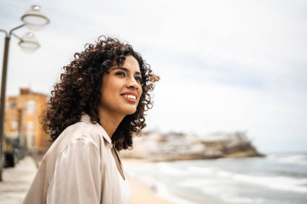 istock Young woman contemplating on the seacoast 1481446076