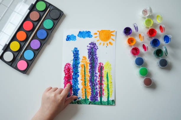 istock Children's drawing with paints top view, hands with paints 1481447097