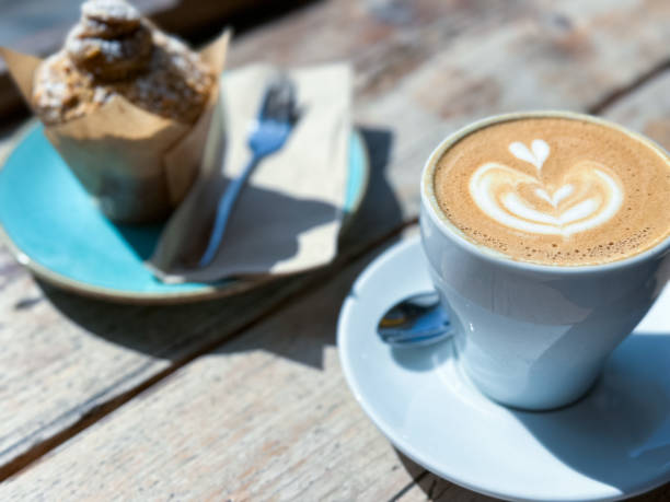 istock Cup of fresh flat white or latte coffee with muffin 1481458852