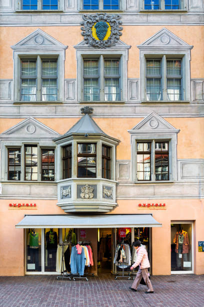 Schaffhausen, Switzerland - February 20, 2022: Facade of a historic medieval house with a family coat of arms in the old town of Schaffhausen