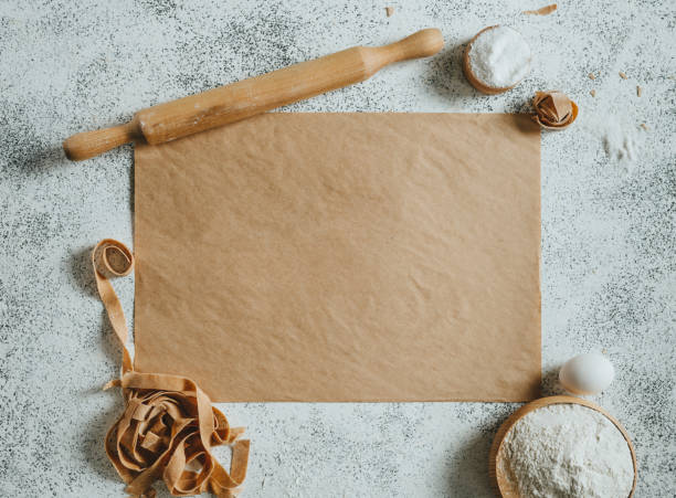 istock Paper with copy space near handmade pasta, rolling pin, flour and eggs 1481466248