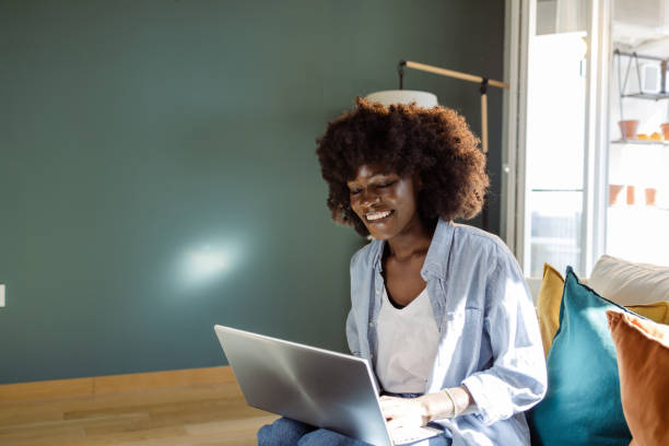 istock A young African American woman is using a laptop 1481468541