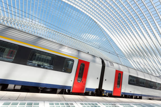 Passenger Train in Futuristic Railroad Station stock photo