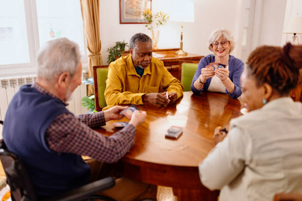 istock Senior friends playing cards 1481473443