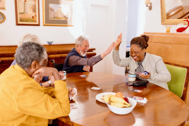 istock Carefree seniors playing cards 1481474768