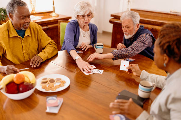 istock Loving multiracial seniors playing cards 1481475959