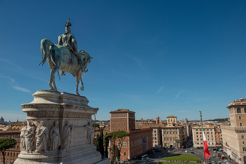 A view from the rooftops of central Rome with the iconic Vittoriano or Altare della Patria, the Capitoline Hill and the ancient Basilica of Santa Maria in Ara Coeli (center photo). The Vittoriano, the Italian national monument built in the historic center of Rome in 1885 in honor of the first king of Italy, Vittorio Emanuele II. Inside are the Altare della Patria and the Monument to the Unknown Soldier, the national commemorative monument dedicated to all the Italian soldiers who died in war. The Altare della Patria is the setting for all the official Italian celebrations, in particular the National Day of the Republic on June 2 and the Liberation Day on April 25. Image in High Definition format.