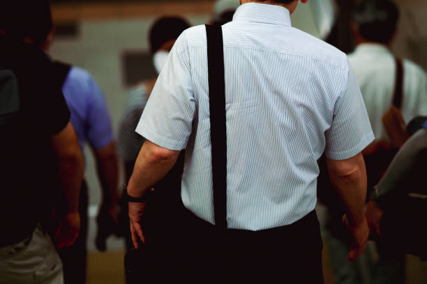 istock back view of walking businessman 1481493914