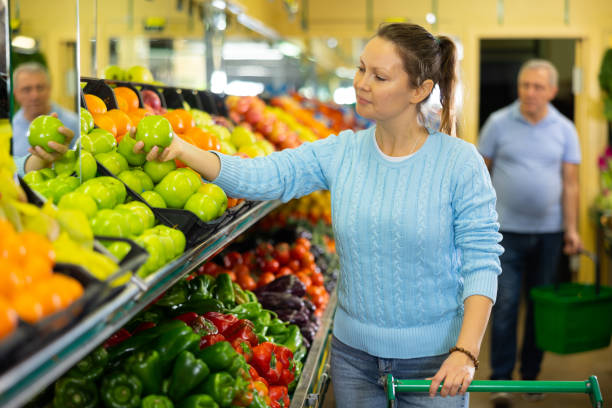 woman chooses apples in  farm shop woman chooses fresh and sweet apples in  farm shop azerbaijani culture stock pictures, royalty-free photos & images