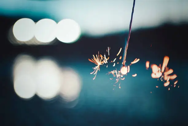 Photo of Scenery with sparklers burning on a summer night