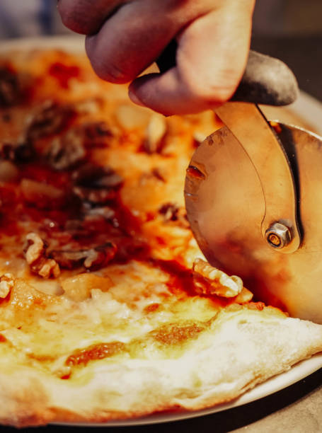istock Chef is doing an amazing job with the pizza cutter 1481502030