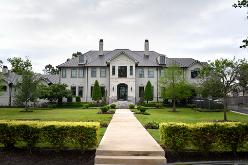 04-02-2023, Houston, TX - A luxurious mansion with an exceptional entrance and landscaping.