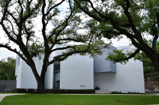 04-02-2023, Houston, TX - A luxurious modern home and driveway.