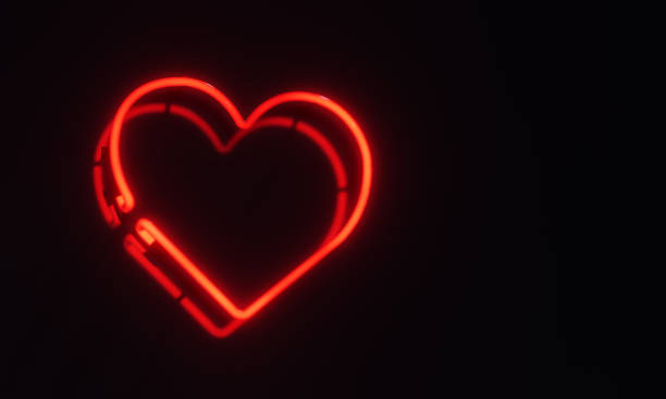 istock Glowing 3D Rendered Neon Heart Sign Over Black Background 1481507862