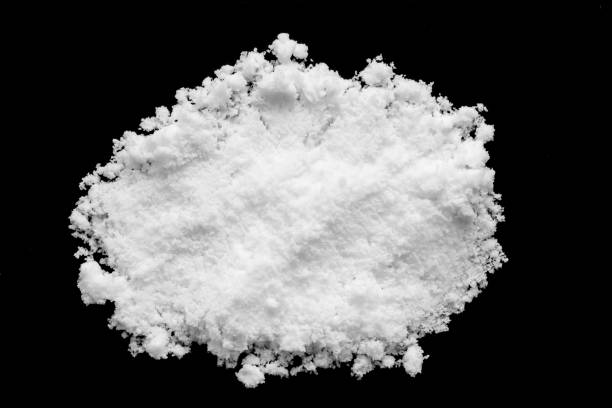 istock White snow isolated on black background close up 1481512086