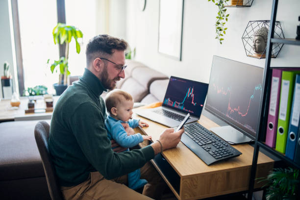 istock Man looking at currency trading app on his smart phone from his home office. 1481512675