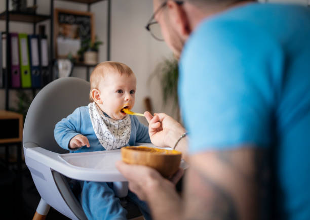 istock Hungry baby eating his lunch. 1481512692