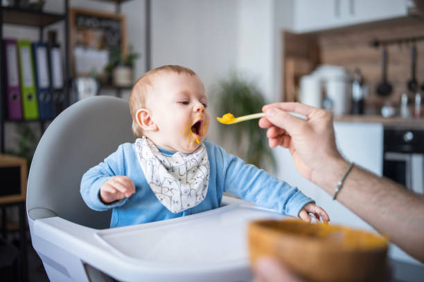 istock Cute baby boy enjoying his delicious lunch. 1481512694