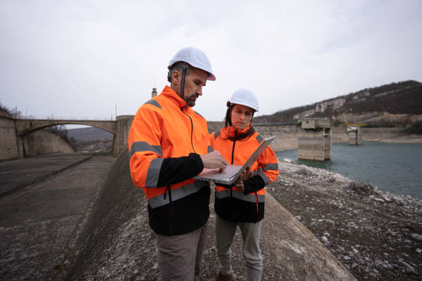 Engineers working in hydroelectric power station.