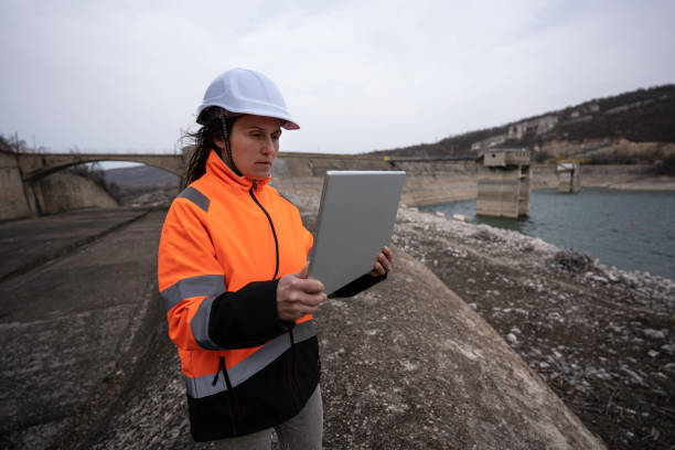 istock Female engineer working in hydroelectric dam. 1481512740