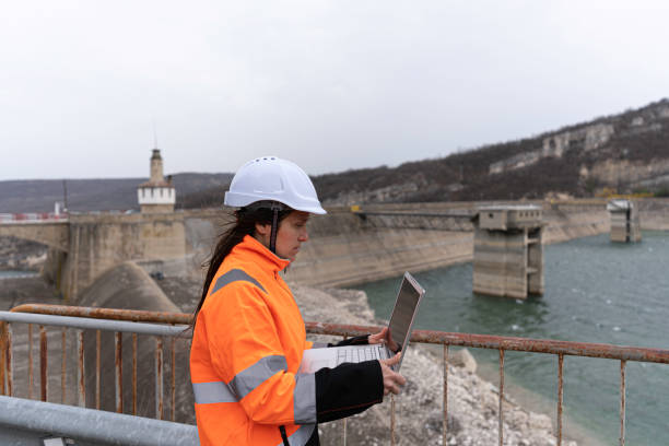 istock Female engineer working in hydroelectric dam. 1481512756