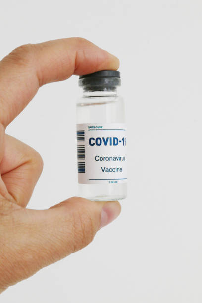 istock An ampoule with a vaccine in hand in close-up. 1481513111
