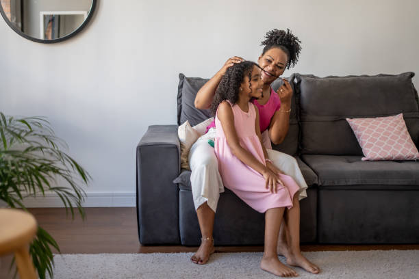 istock Mother combing daughter's hair 1481513546