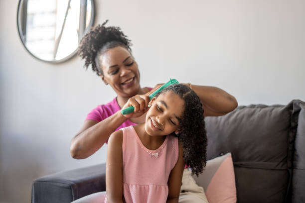 istock Mother combing daughter's hair 1481513559