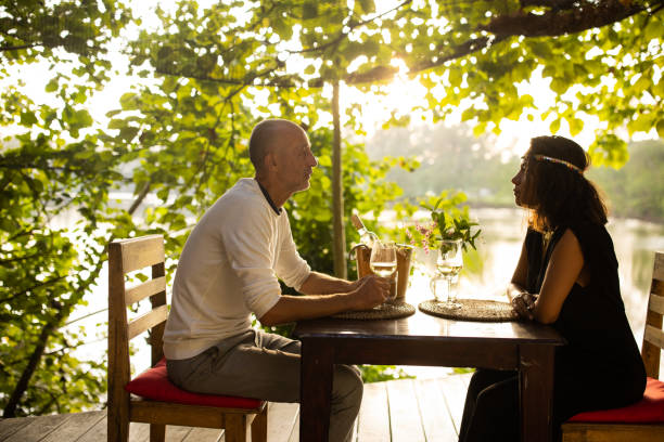 istock Couple in restaurant by the lake 1481519831