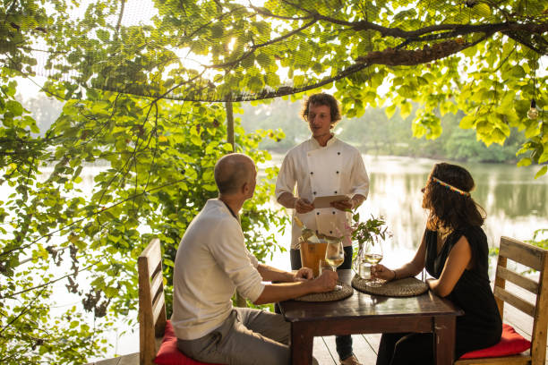istock Couple ordering food from a waiter 1481520693