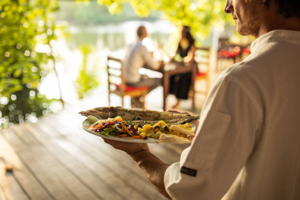 istock Waiter carrying seafood 1481521004