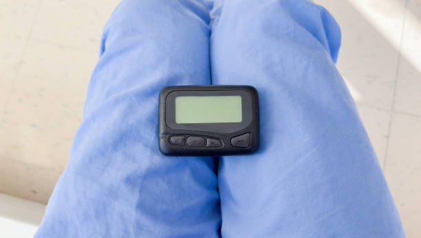 istock Pager is a small wireless device that receives and displays numeric or text messages, symbolizing the era of technological advancements in communication and transition from analog to digital device 1481522071