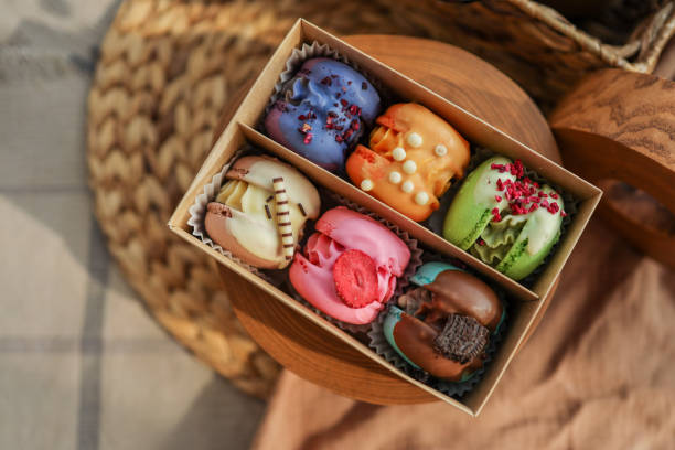 Box of macaroons with different assortment top view in a homely atmosphere