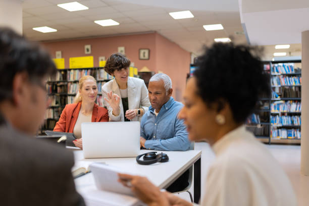 istock Readers and students in the library 1481524326