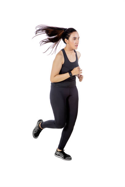 istock Beautiful young woman jogging on studio 1481542681