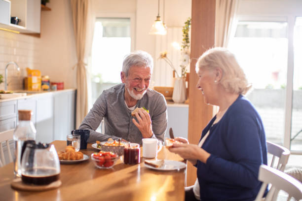 istock Senior couple having breakfast together at home 1481544603