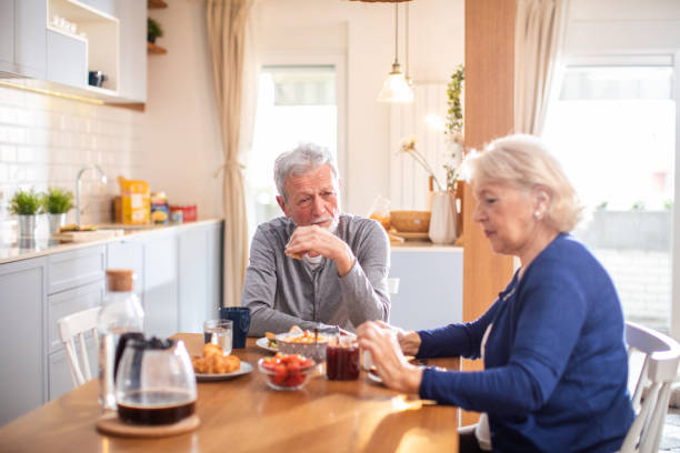istock Senior couple having breakfast together at home 1481547379