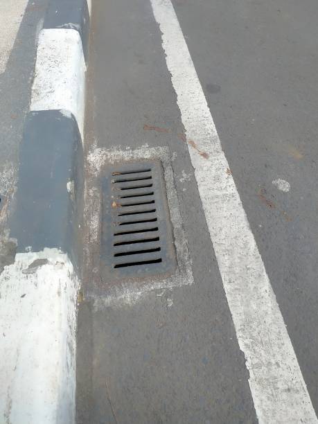 istock Iron grating as a drain on the roadside 1481553515