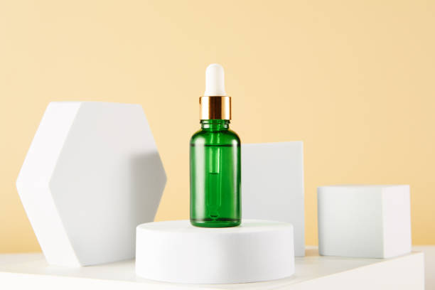 istock Green glass serum container mockup with pipette. 1481553773