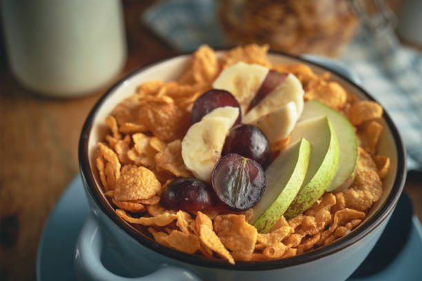 Cornflakes with Banana, Apples and Grapes for Breakfast