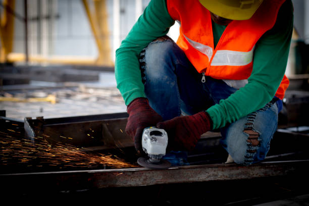 istock Young asian worker using grinder cut iron with hands working in industrial factory, welder man or labor cut steel while having sparkle, occupation technician and skill, industry concept. 1481554536