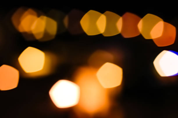 istock background abstract street night orange lights with bokeh effect 1481554573