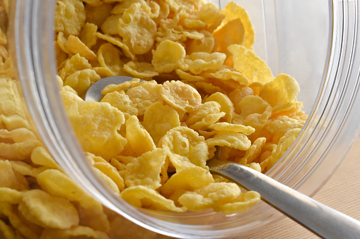 Cornflakes on spoon.  Cereal background.  Healthy breakfast concept.