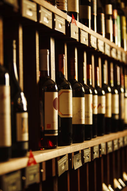 istock Wine cellar with elite drinks on shelves with written names 1481555704