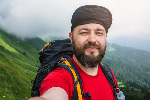 Hiker taking selfie in the mountains