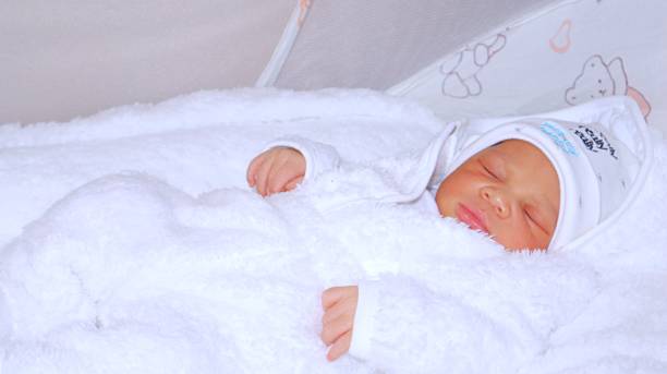 istock Newborn  baby in deep sleep covered in blankets 1481570977
