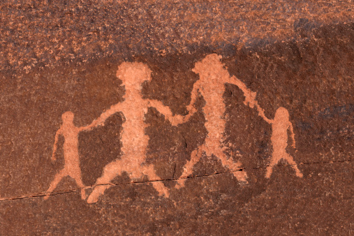 Ancient petroglyph family depiction in Nevada's Mojave Desert.
