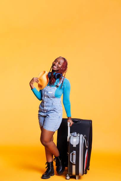istock Happy person with hat and suitcase 1481577889