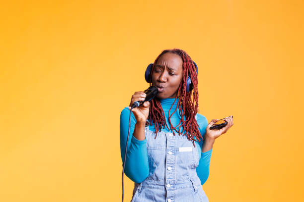 istock Confident girl having fun with karaoke 1481579327