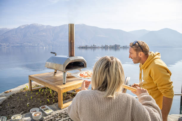 istock Friends making pizza at home in the garden 1481580008